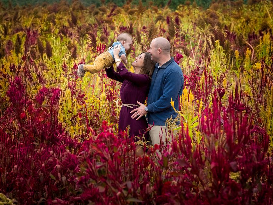 Family together in a colorful autumn field